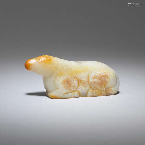 A pale green and russet jade carving of a horse   Probably 17th/18th century