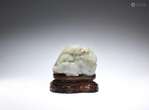 A pale green and russet jade ram group, sanyang  18th century