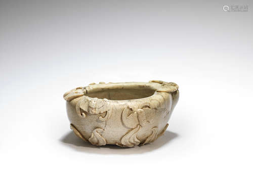 A chicken bone jade 'peach' washer  18th century