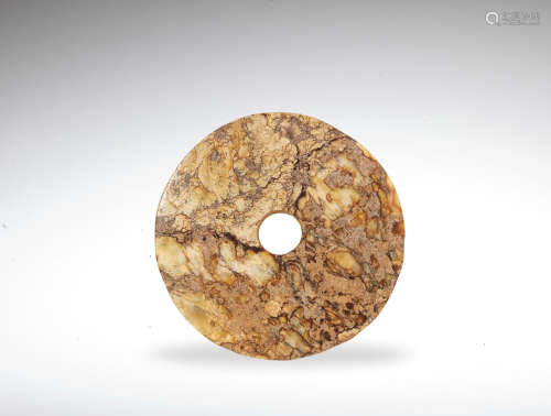 A Neolithic style jade disc, bi