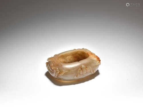 A pale green and russet jade washer  Qing Dynasty or later