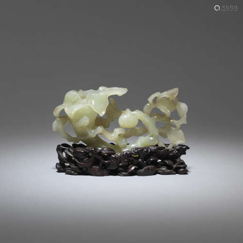 A pale green jade 'magnolia, melon and lingzhi' reticulated carving  17th/18th century
