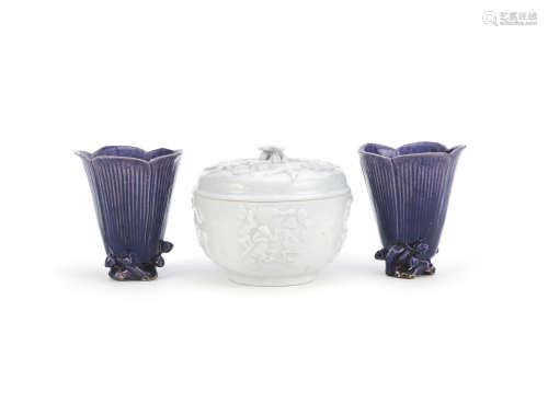 A blanc-de-Chine box and cover; together with a pair of aubergine-glazed 'Magnolia' cups  Early 18th century