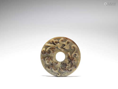 A green and russet jade 'chilong' disc, bi  Ming Dynasty