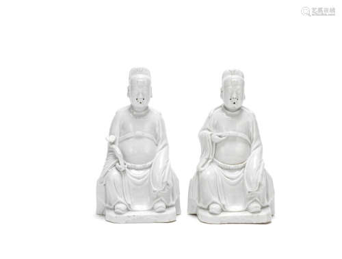 Two blanc-de-chine figures of seated Officials  17th century