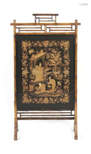 A late 19th / early 20th century bamboo screen, the Chinese silk panel worked in couched gold