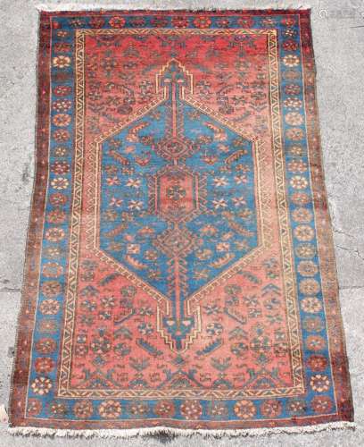 Property of a lady of title - a Persian Hamadan rug, 76 by 51ins. (193 by 130cms.).