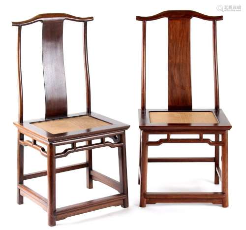 A pair of Chinese hongmu official's hat chairs, early 20th century, with woven seats (2).