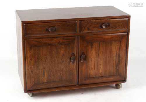 Property of a deceased estate - an Ercol elm side cabinet with two drawers above two doors,