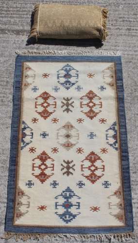 Property of a deceased estate - a Walton & Co. wool rug, 58 by 36ins. (146 by 90cms.); together with