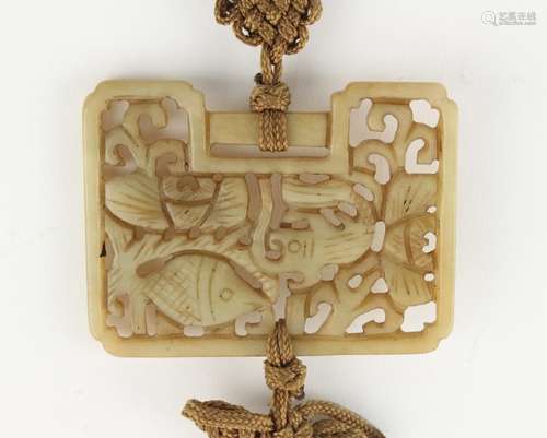 Property of a deceased estate - a Chinese carved jade rectangular panel, with pierced fish