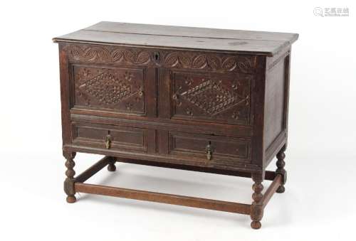 Property of a gentleman - a carved oak mule chest, parts 18th century, the hinged top above two
