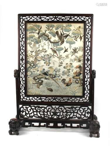 A late 19th century Chinese carved hongmu table screen with embroidered silk 'One Hundred Birds'