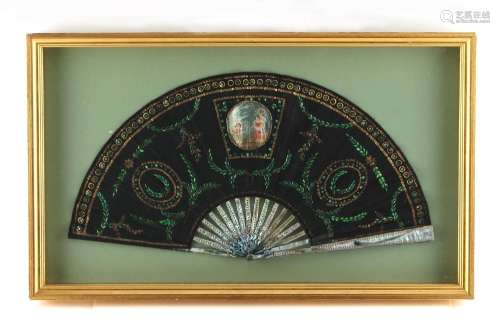 Property of a lady - a late 19th / early 20th century sequined black lace fan with mother-of-pearl