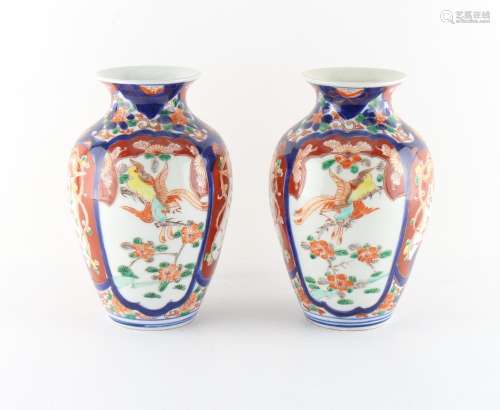 Property of a lady - a pair of Japanese Imari vases, each 8.35ins. (21.2cms.) high (2).