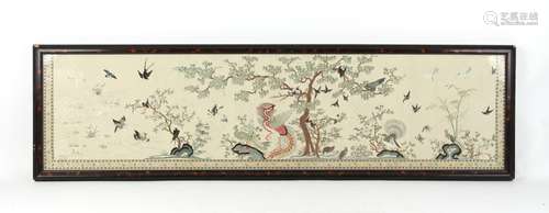 A long late 19th / early 20th century Chinese embroidered silk panel depicting a phoenix & other