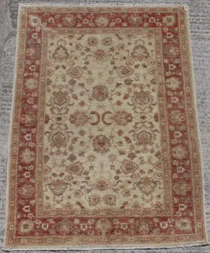 Property of a deceased estate - a Ziegler style rug, 77 by 55ins. (196 by 140cms.).