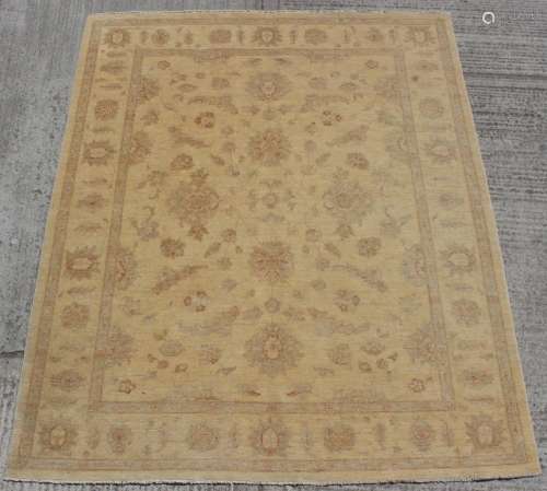 Property of a deceased estate - a Ziegler style carpet, 118 by 97ins. (299 by 247cms.).