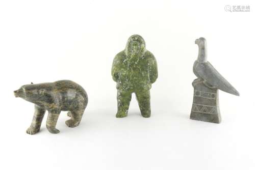 Property of a lady - three Inuit stone carvings, one signed Phineas, the tallest 7.7ins. (19.