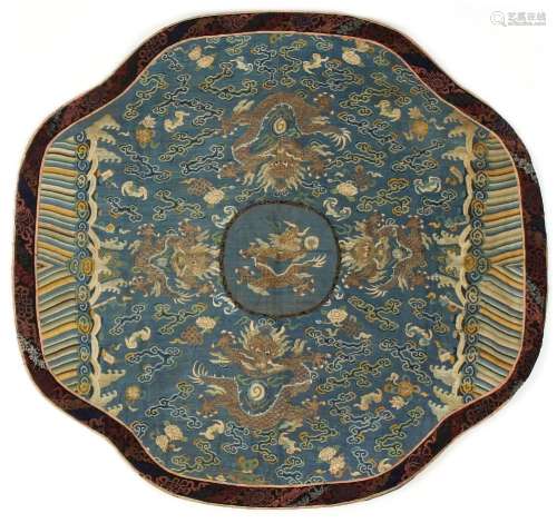 A 19th century Chinese kesi dragon quatrefoil panel, with a central dragon within a pale blue ground