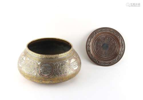 A late 19th / early 20th century Cairo ware damascened brass bowl with copper & silvered calligraphy