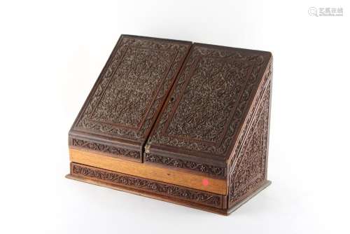 Property of a lady - an Indian carved writing box with twin door sloping front enclosing
