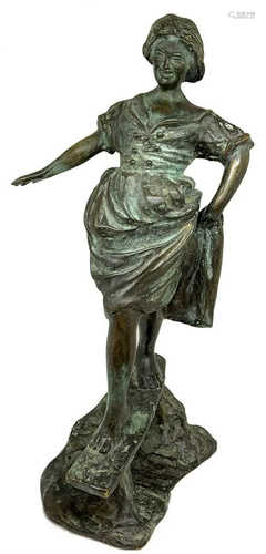 Bronze sculpture depicting woman balanci…