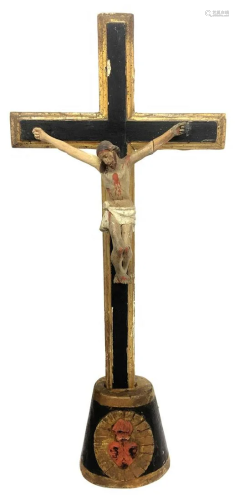 Wooden crucifix on base with the heart of Je…