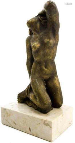 Bronze sculpture depicting a naked woma…