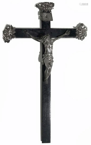 Crucified Christ in silver on a wooden cross…