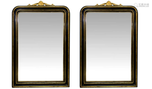 Pair of mirrors with black ebonized wood trim…