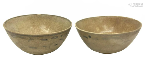 Two glazed ceramic celadon bowls with simple