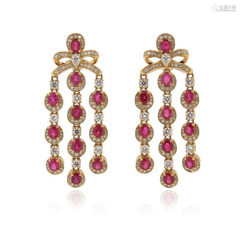 A pair of ruby and diamond-set gold drop earrings, with bow-form upper sections, each suspending