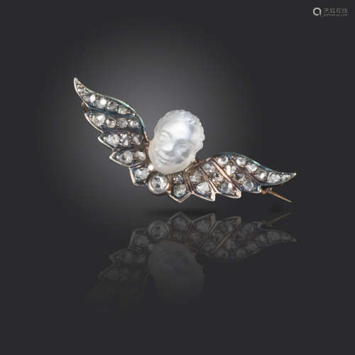 A Victorian diamond and moonstone cherub brooch, the carved moonstone head set above rose-cut