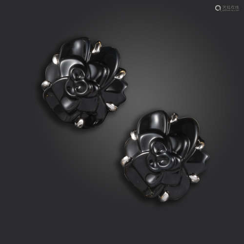 A pair of onyx flowerhead earrings by Chanel, 18ct white gold mounts, signed Chanel and
