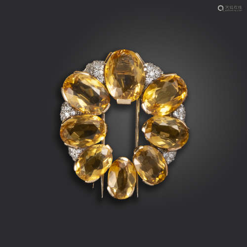 A citrine and diamond-set gold brooch, of oval form, set with graduated oval-shaped citrines and