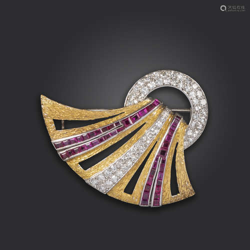 A ruby and diamond-set gold scroll brooch, designed as a piece of stylised fabric falling through