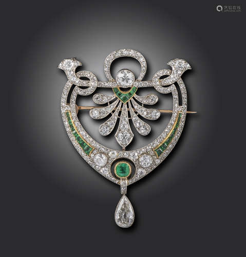 An early 20th century emerald and diamond brooch pendant, set overall with graduated old circular-