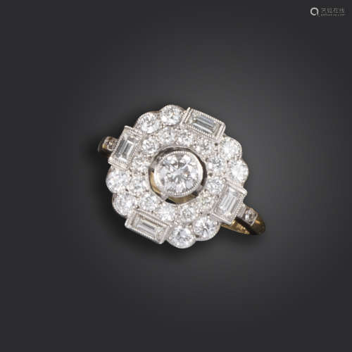 A diamond cluster ring, centred with a round brilliant-cut diamond within a quatrefoil surround