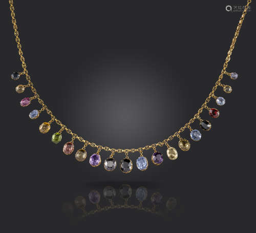 An Edwardian gold fringe necklace, set with sapphires, garnets, amethysts and zircons in yellow gold