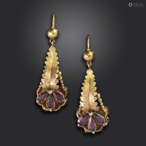 A pair of Victorian garnet-set gold drop earrings, of foliate design, set with pear-shaped garnets