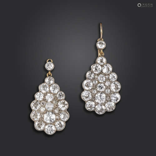 A pair of diamond drop earrings, the pear-shaped drop sections pavé-set with old circular and