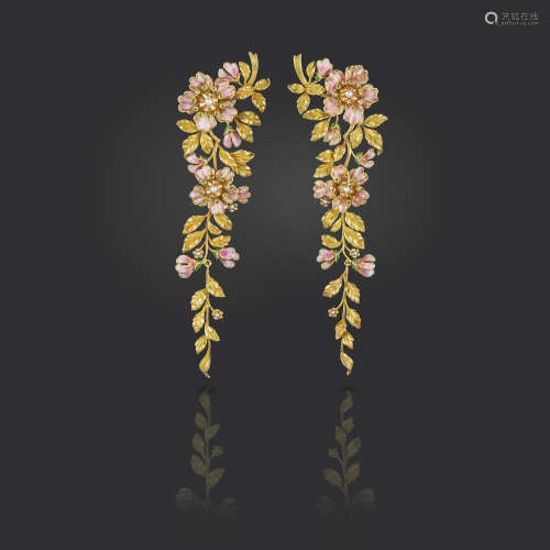 A pair of gold foliate drop earrings, designed as a sprig of wild roses, the flower heads centred