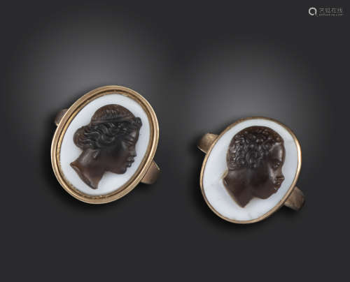 A pair of 19th century blackamoor cameo rings, each mounted with a hardstone cameo of a