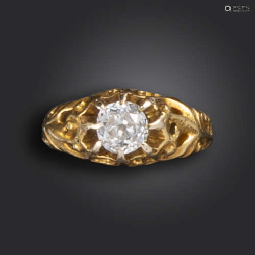 A 19th century diamond solitaire ring, the old cushion-shaped diamond is set within gold scroll