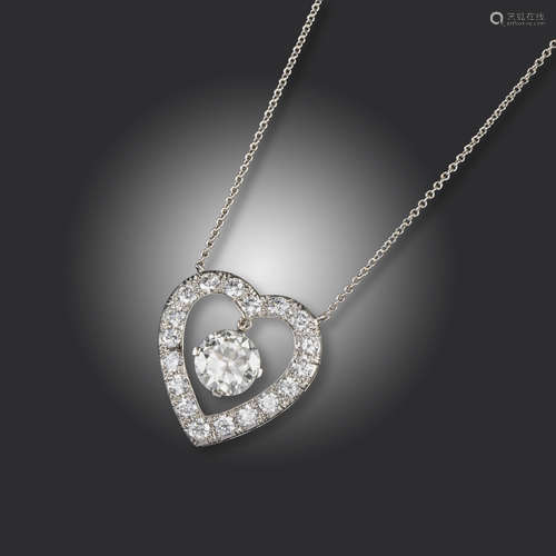 A heart-shaped diamond pendant by J E Caldwell & Co, the heart set with circular-cut diamonds and