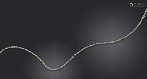 A diamond-set platinum neck chain, the navette and circular-shaped links are set with circular-cut