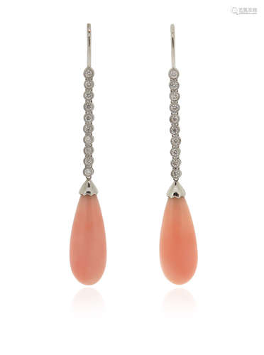 λ A pair of coral and diamond drop earrings, the coral drops suspend from articulated round