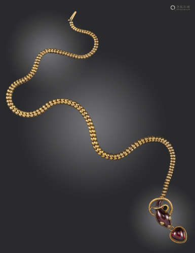 A Victorian garnet and diamond snake necklace, the stylised serpent with a cabochon garnet head