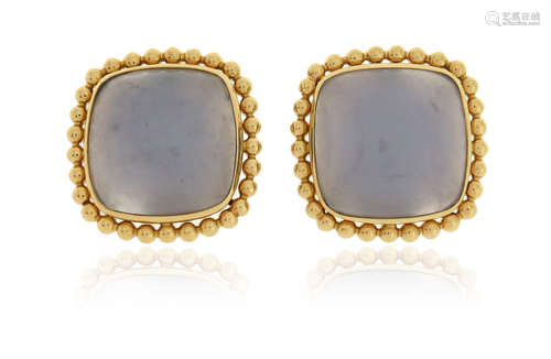 A pair of blue chalcedony cabochon earrings, set within yellow gold pellet borders, 1.9cm wide,